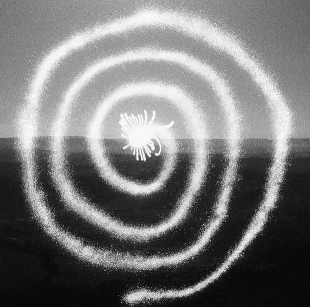 Cognitive Architecture — a white spiral drawn in light