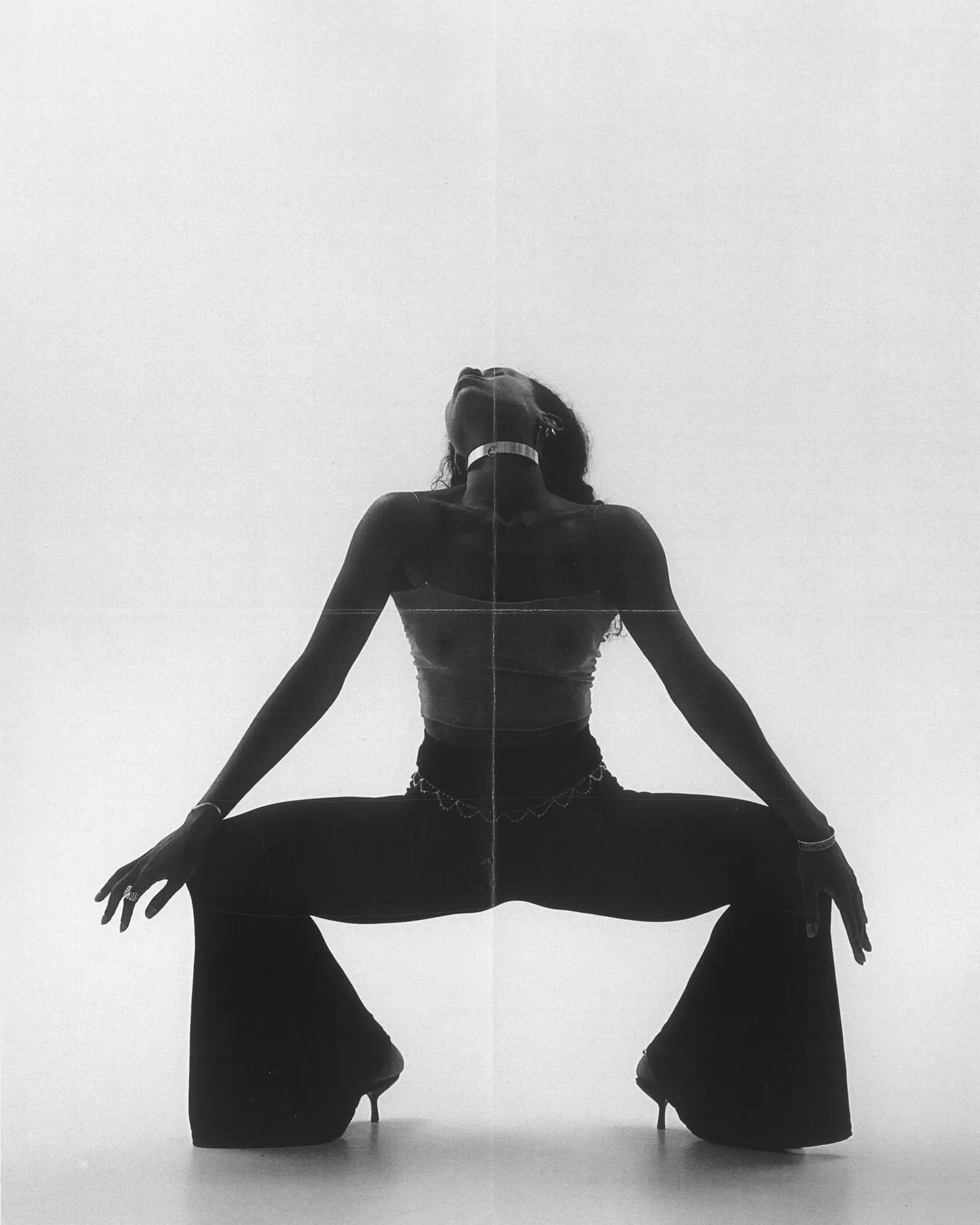 Symbol Dance pose — seated silhouette